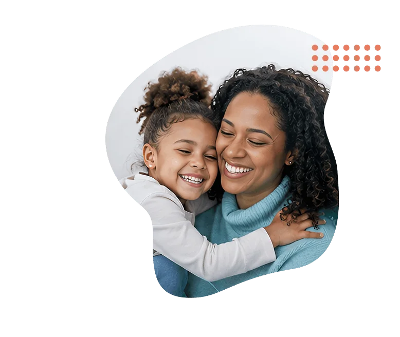Mother and young daughter smiling and embracing, framed by Clearpath's coral dot pattern.